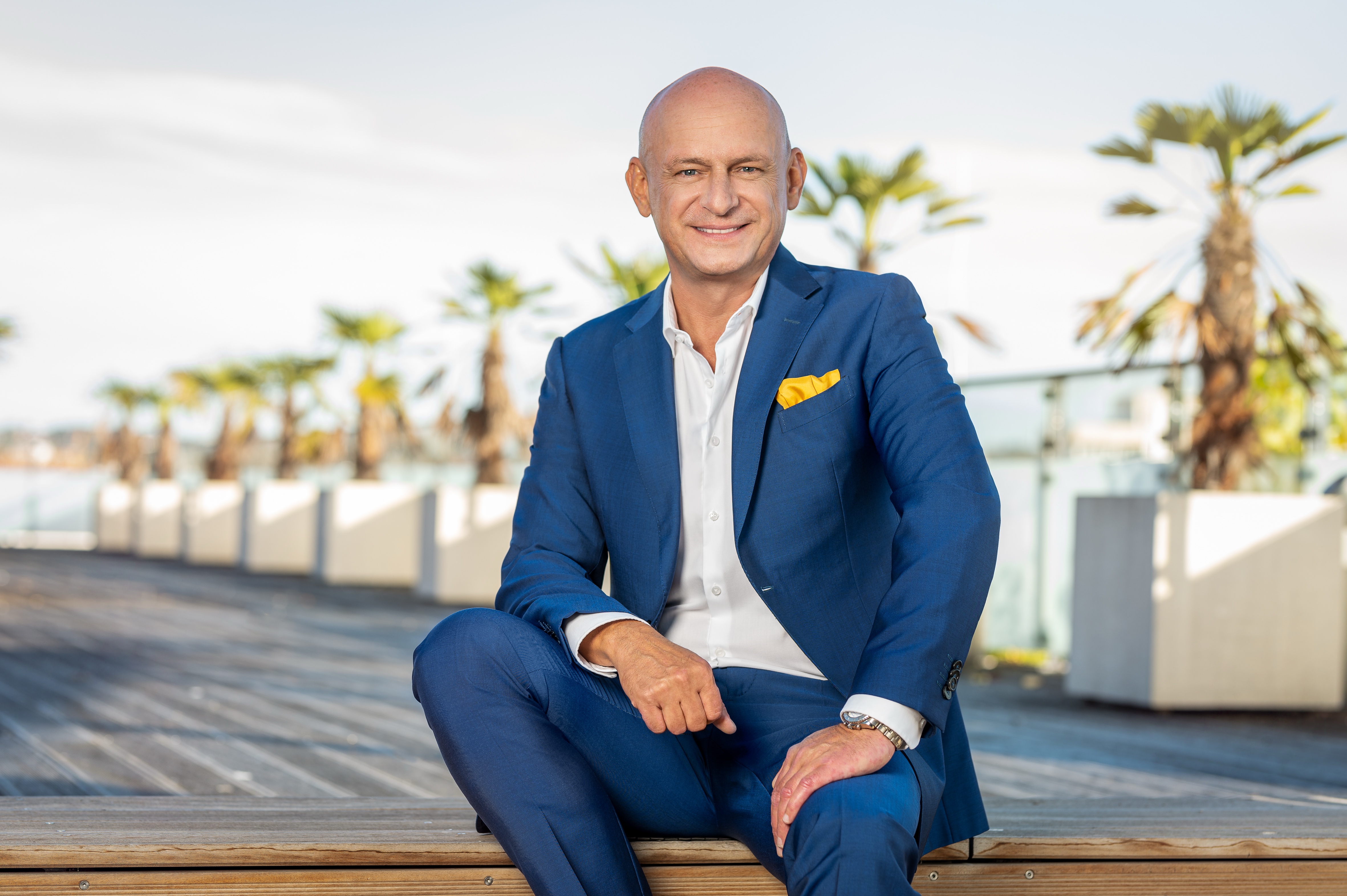 Hubert Freidl – Strategic Advisor, seated, waterfront Dubai